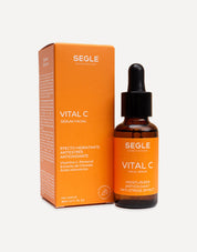 Frasco de sérum con pipeta, envase de vidrio ámbar y etiqueta minimalista sobre fondo de color naranja.
